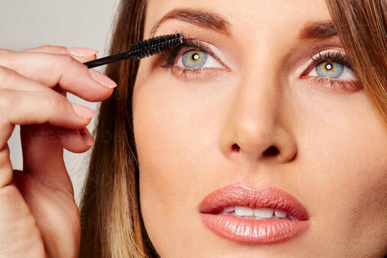 woman applying mascara
