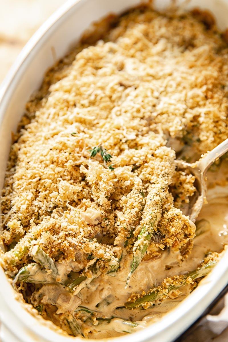 Close-up of golden brown buttery crumb topping on green bean casserole
