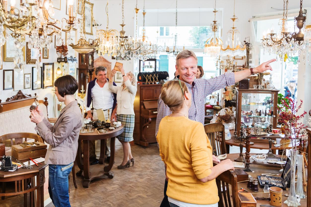 people browsing an antique store