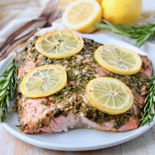 raw salmon fillet with lemon and herbs
