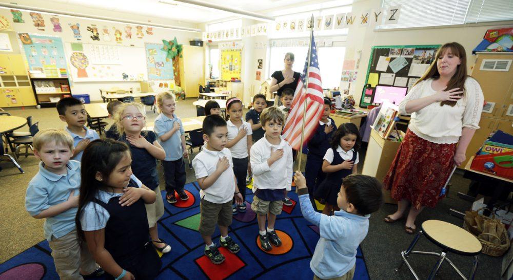 diverse group of kids reciting pledge of allegiance