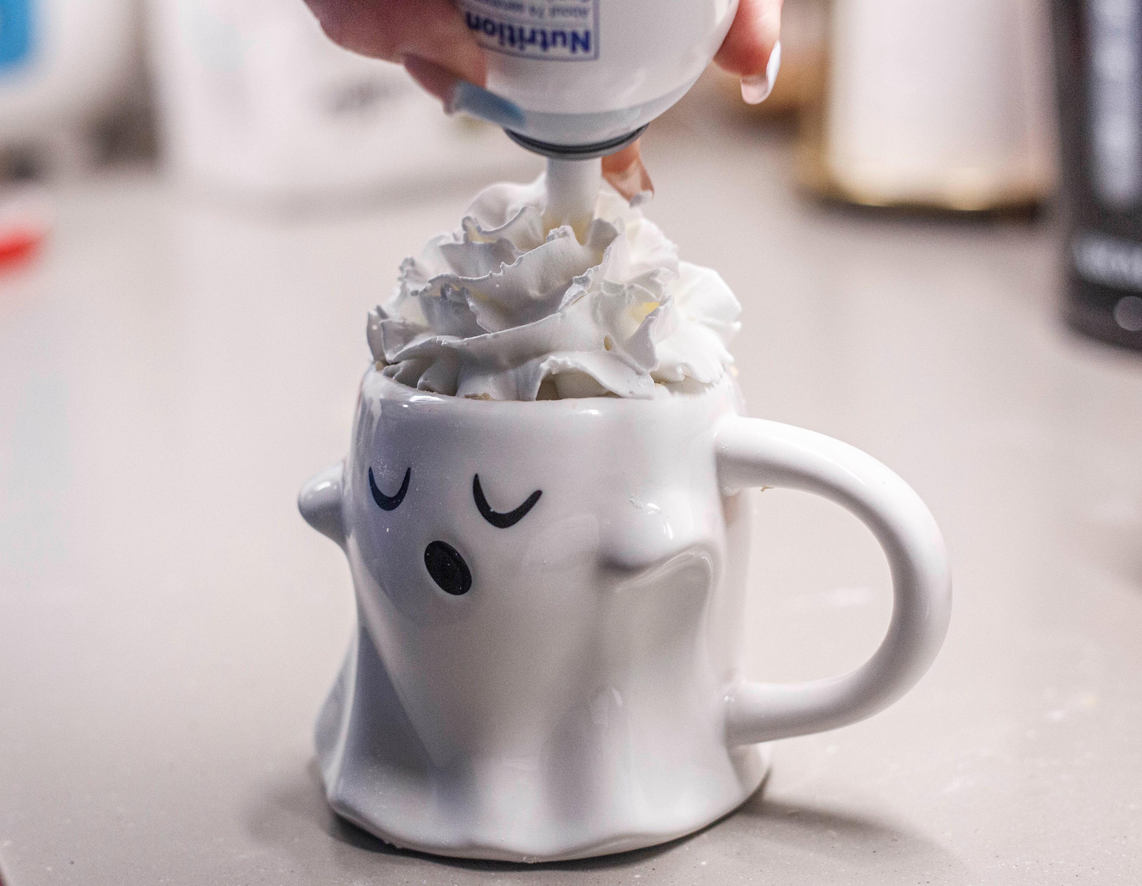 Overhead shot of a prepared Mike and Ike mug cake in a white mug