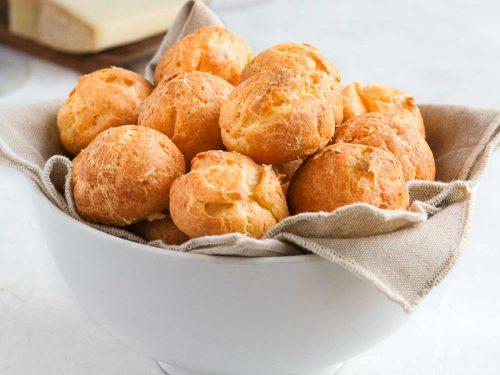 savory cheese puffs golden brown light airy texture on a cooling rack