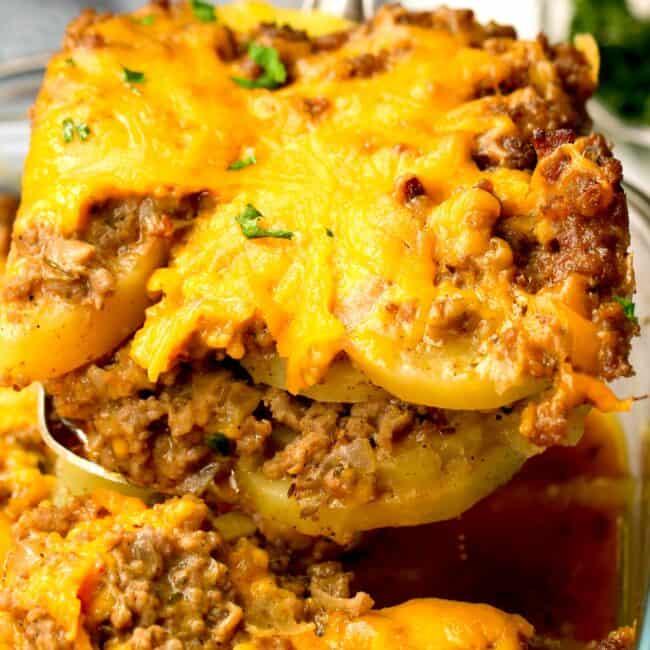 close-up shot of a slice of ground beef and potato casserole being served