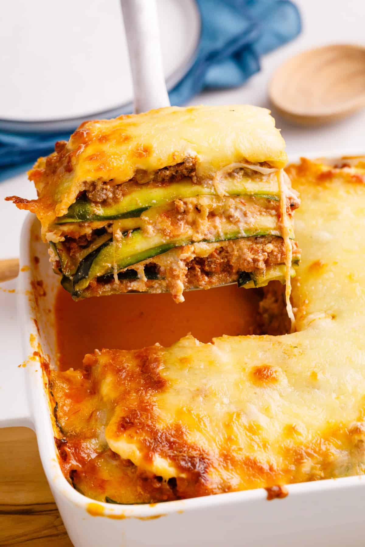 close-up of a slice of keto zucchini lasagna with melted cheese