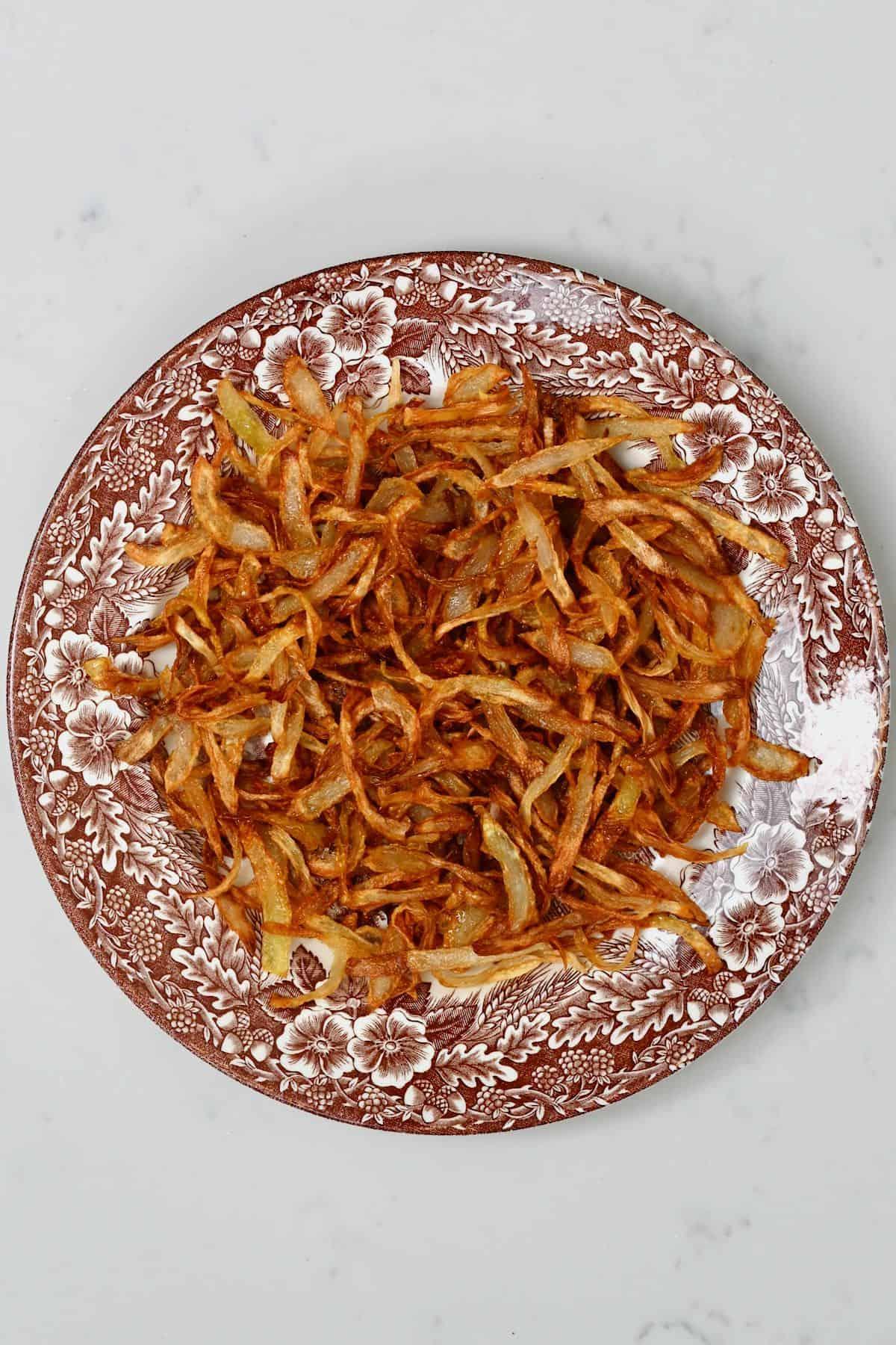 Bowl of crispy fried onions, ready to be sprinkled