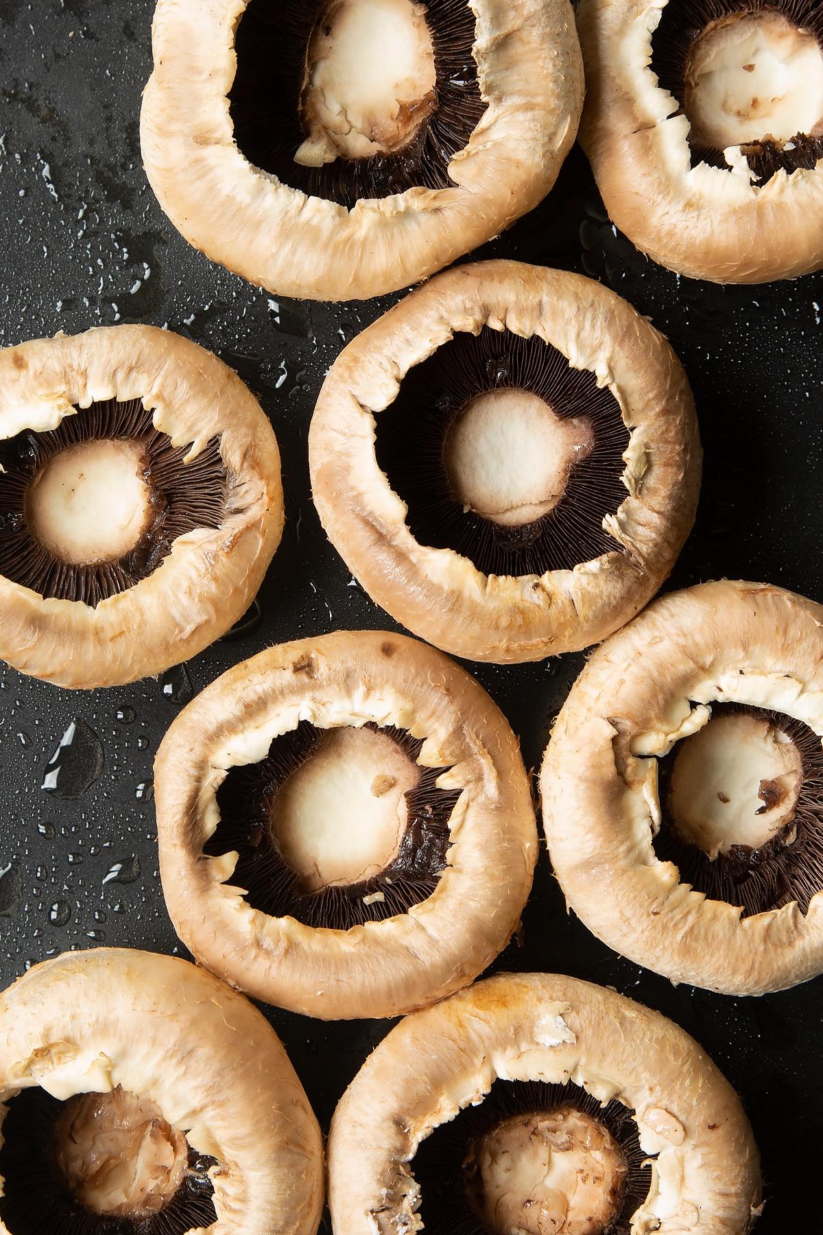 Overhead shot of freshly baked stuffed mushrooms coming out of the oven