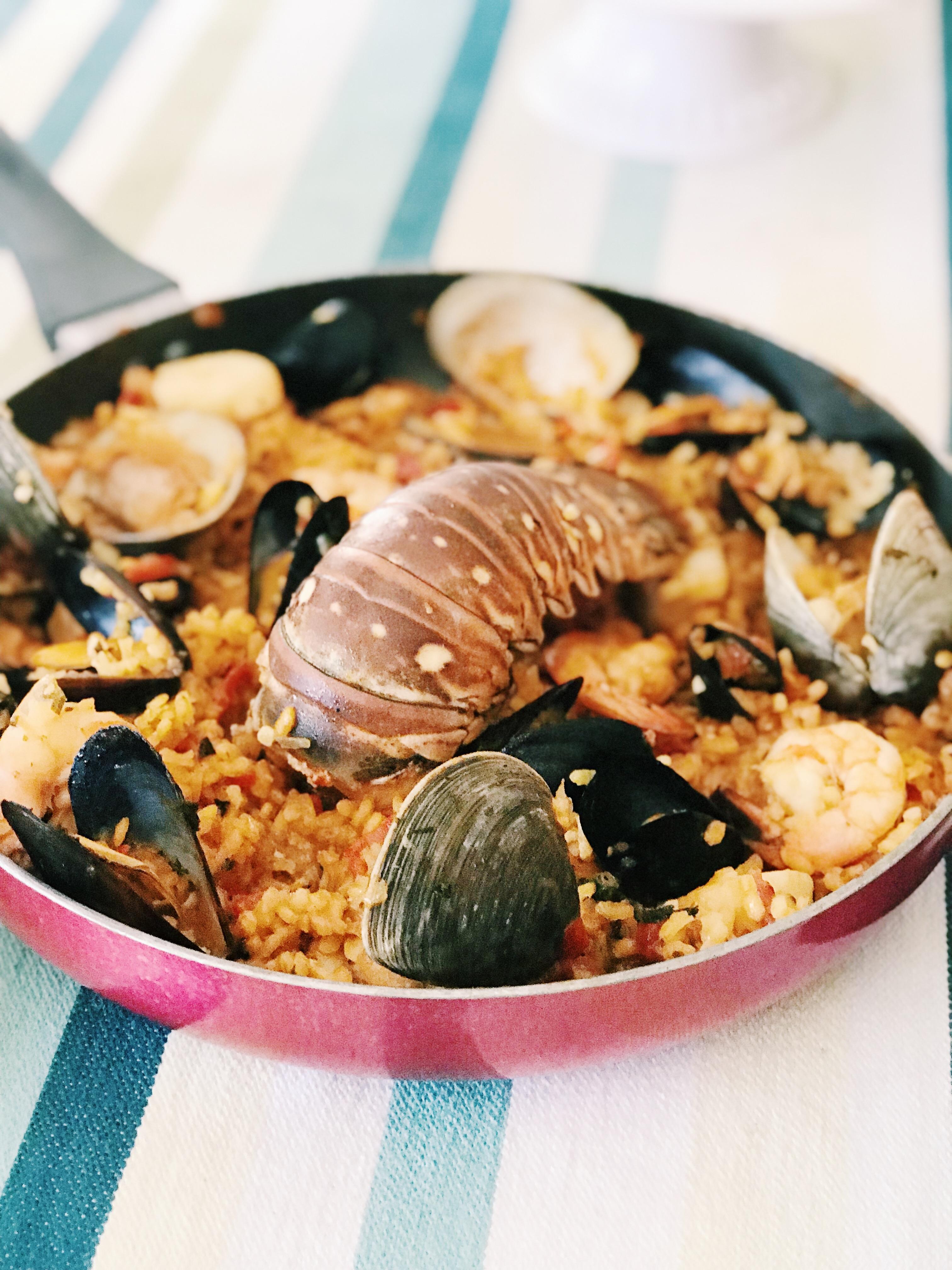 delicious seafood paella served at a beach party