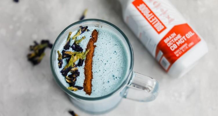 close up of spirulina powder being added to cold brew