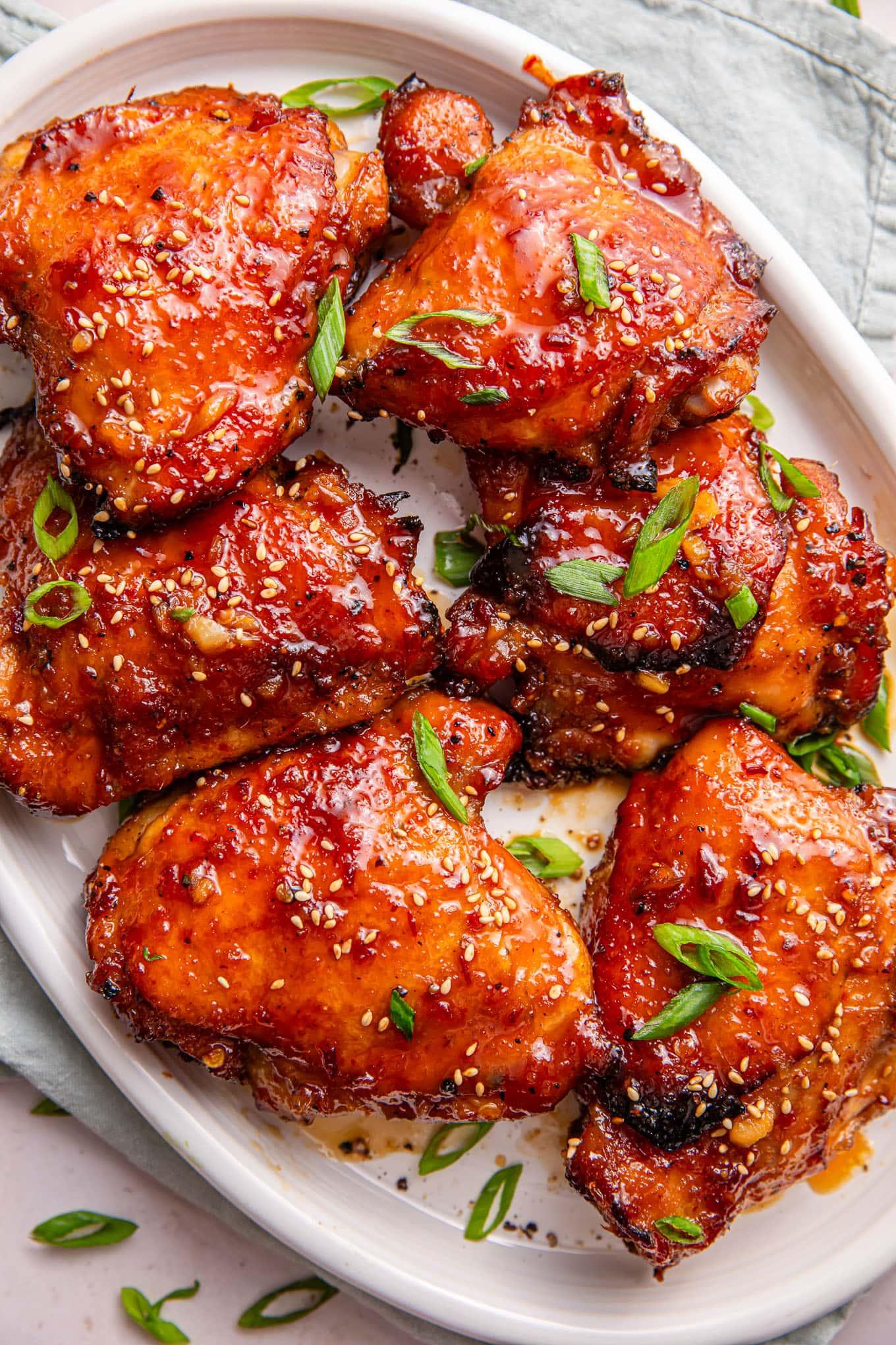 honey soy glazed chicken being cooked in a pan