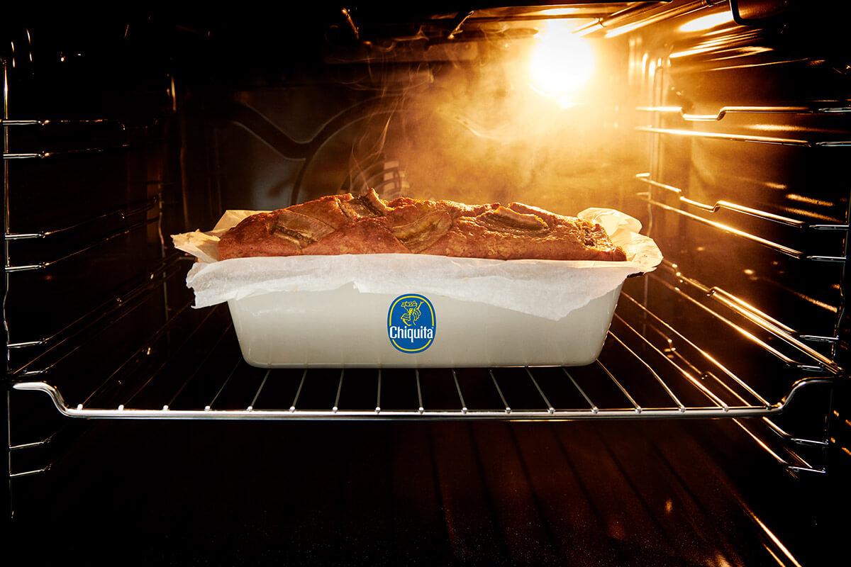 banana bread baking in oven