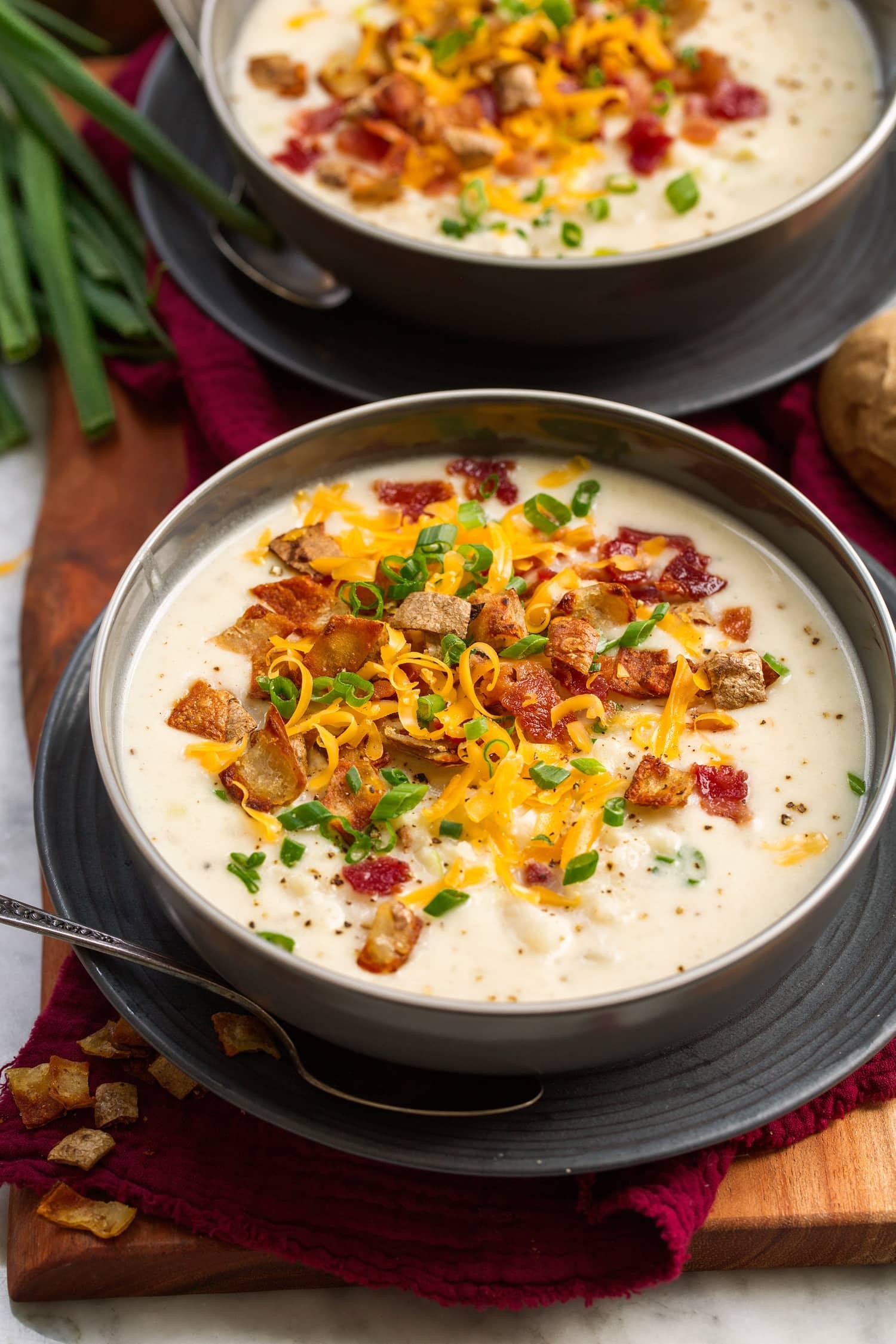 bowl of loaded baked potato soup with toppings