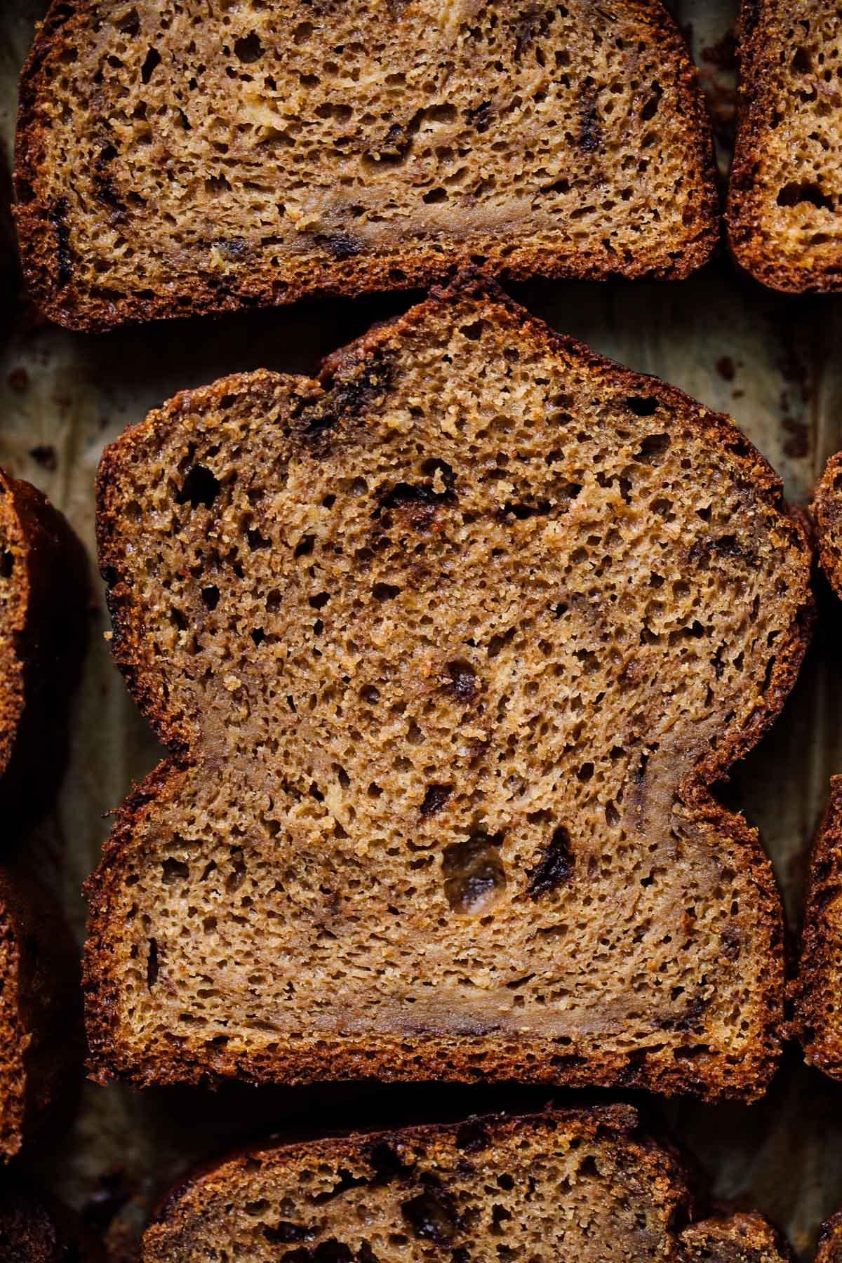 close-up shot of a slice of whole wheat banana bread with a rustic texture