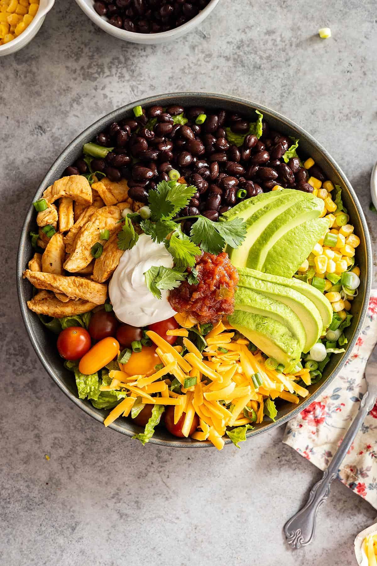 close-up shot of a perfectly layered chicken taco bowl with visible textures