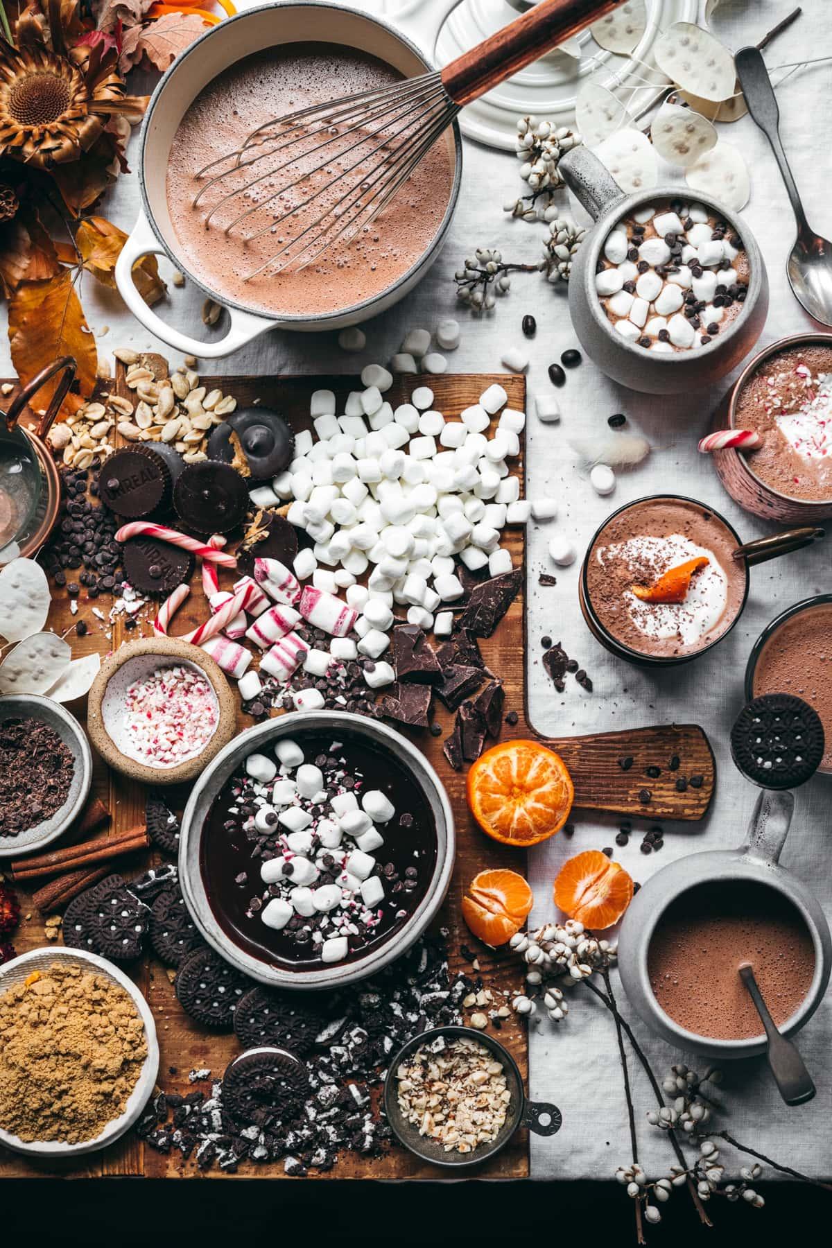 hot chocolate ingredients arranged on a rustic wooden table