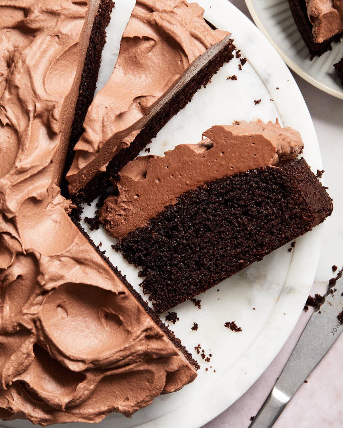 Close-up of a perfectly baked almond flour chocolate cake, showing its moist crumb and rich brown color.