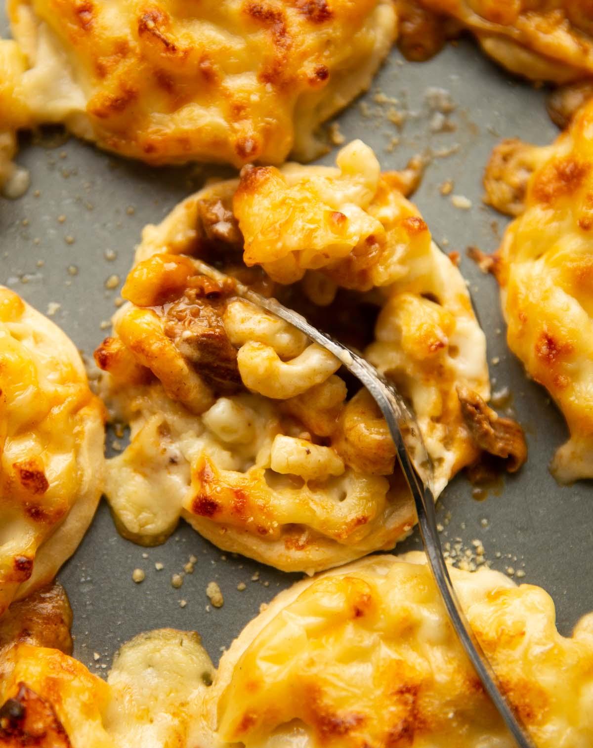 close-up shot of golden bubbly mac and cheese crust on top of a pot pie