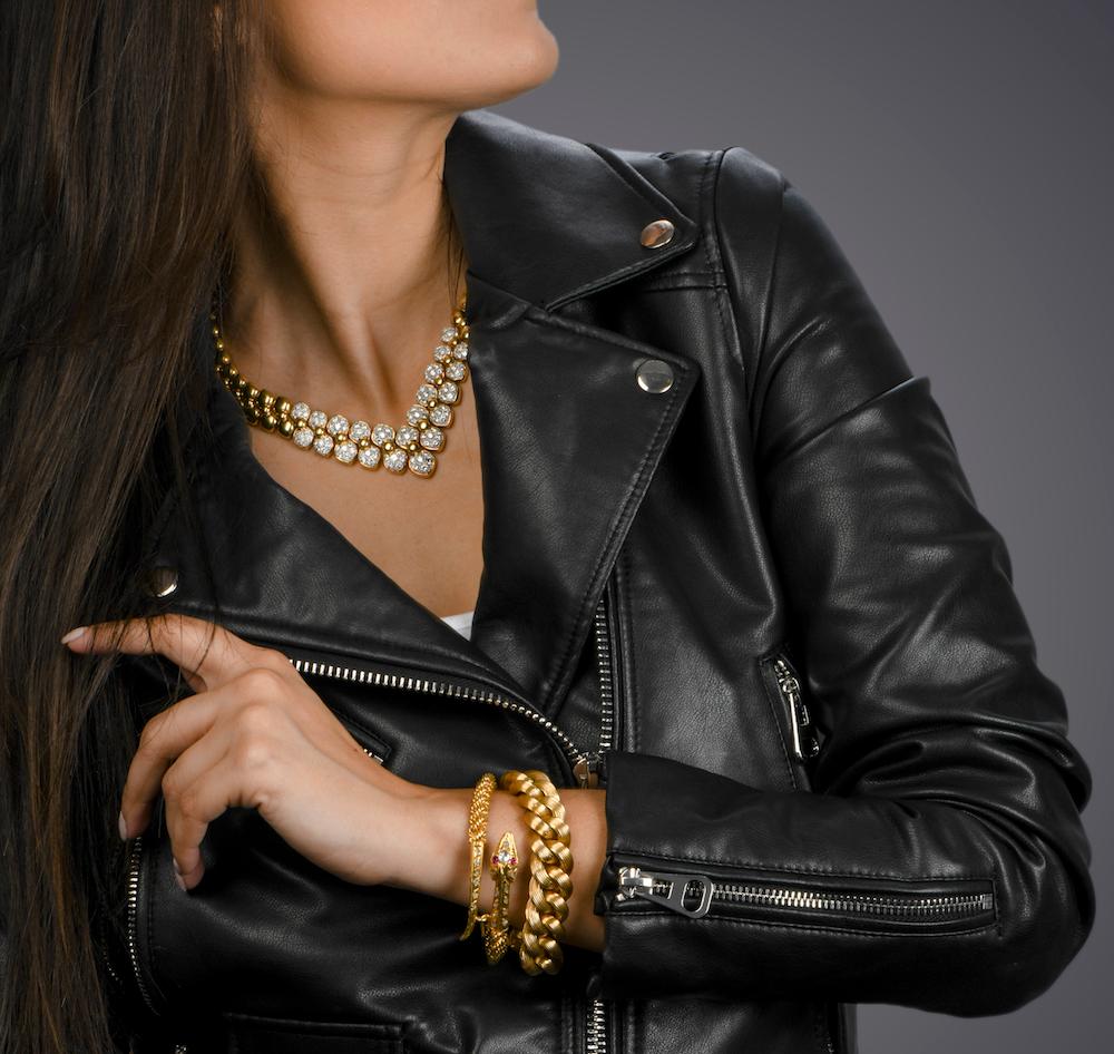 close up of vintage and modern jewelry on a styled outfit