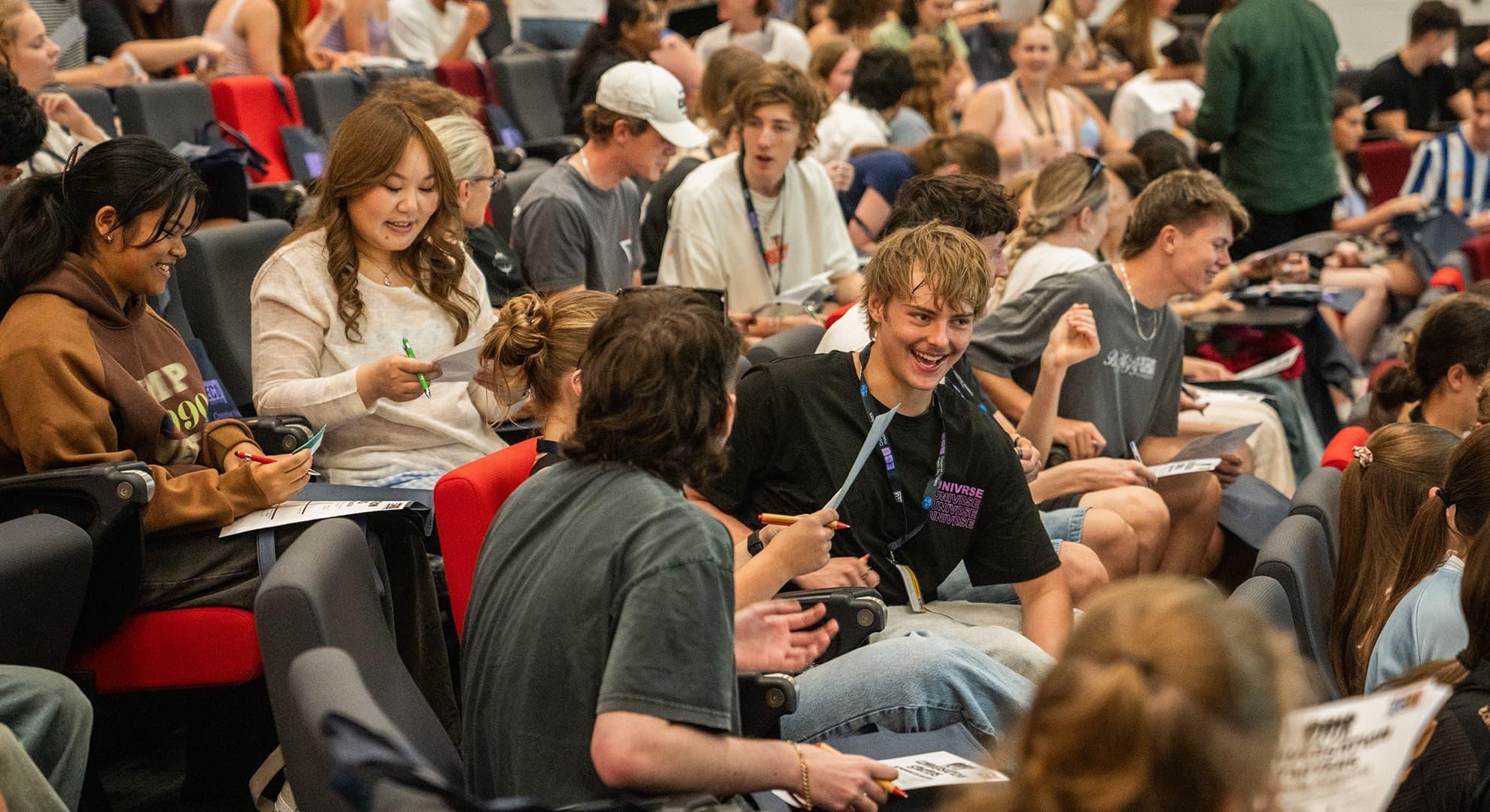 students laughing and talking at orientation