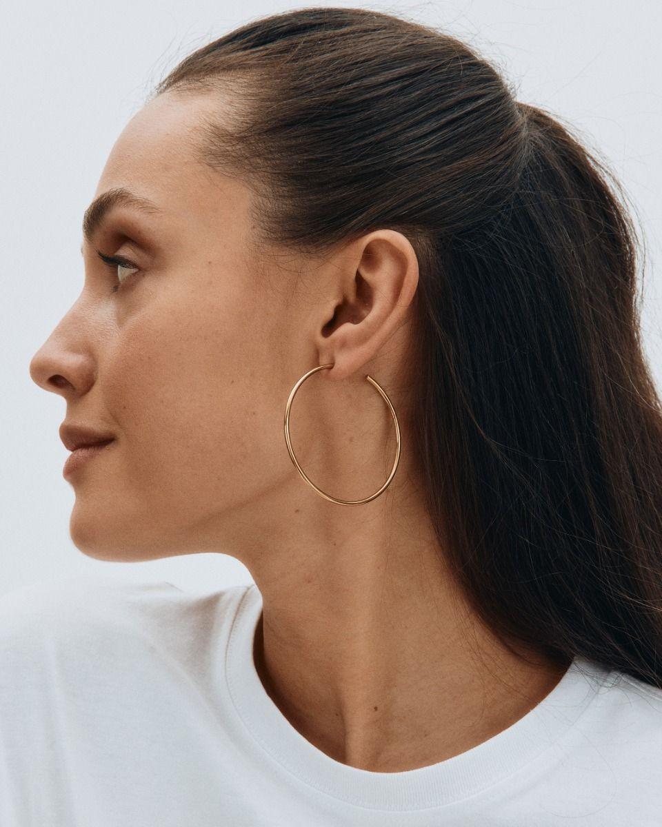 large gold hoops on model