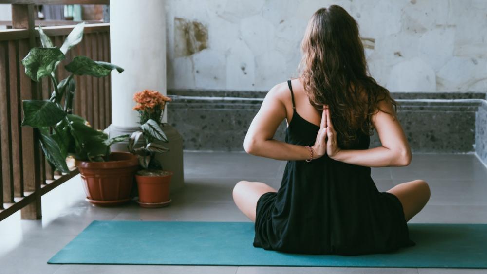 woman listening to her body during yoga