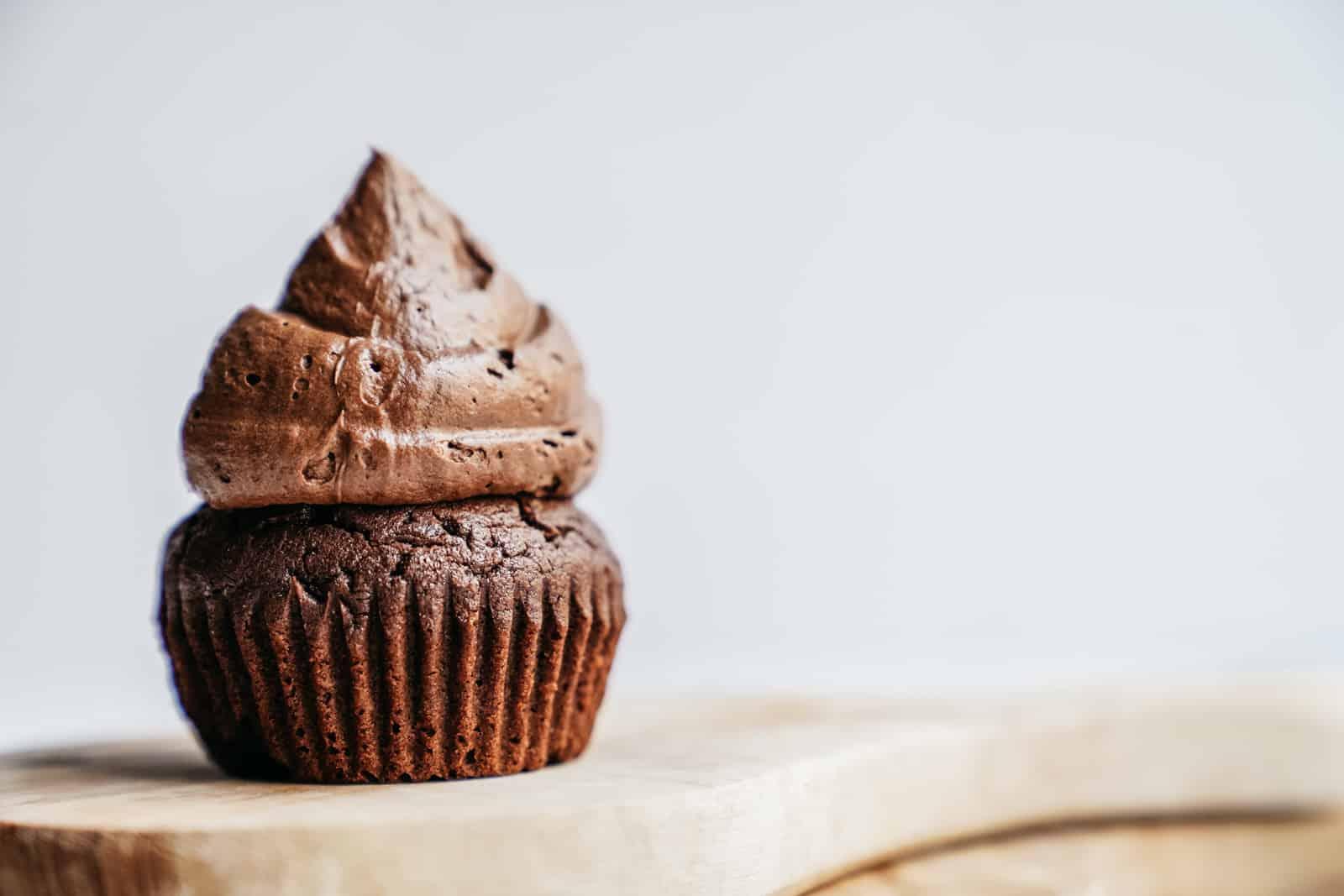 close-up of a vegan brownie muffin with a gooey center