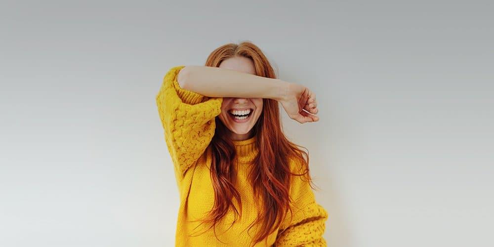 shy woman confidently posing for photos