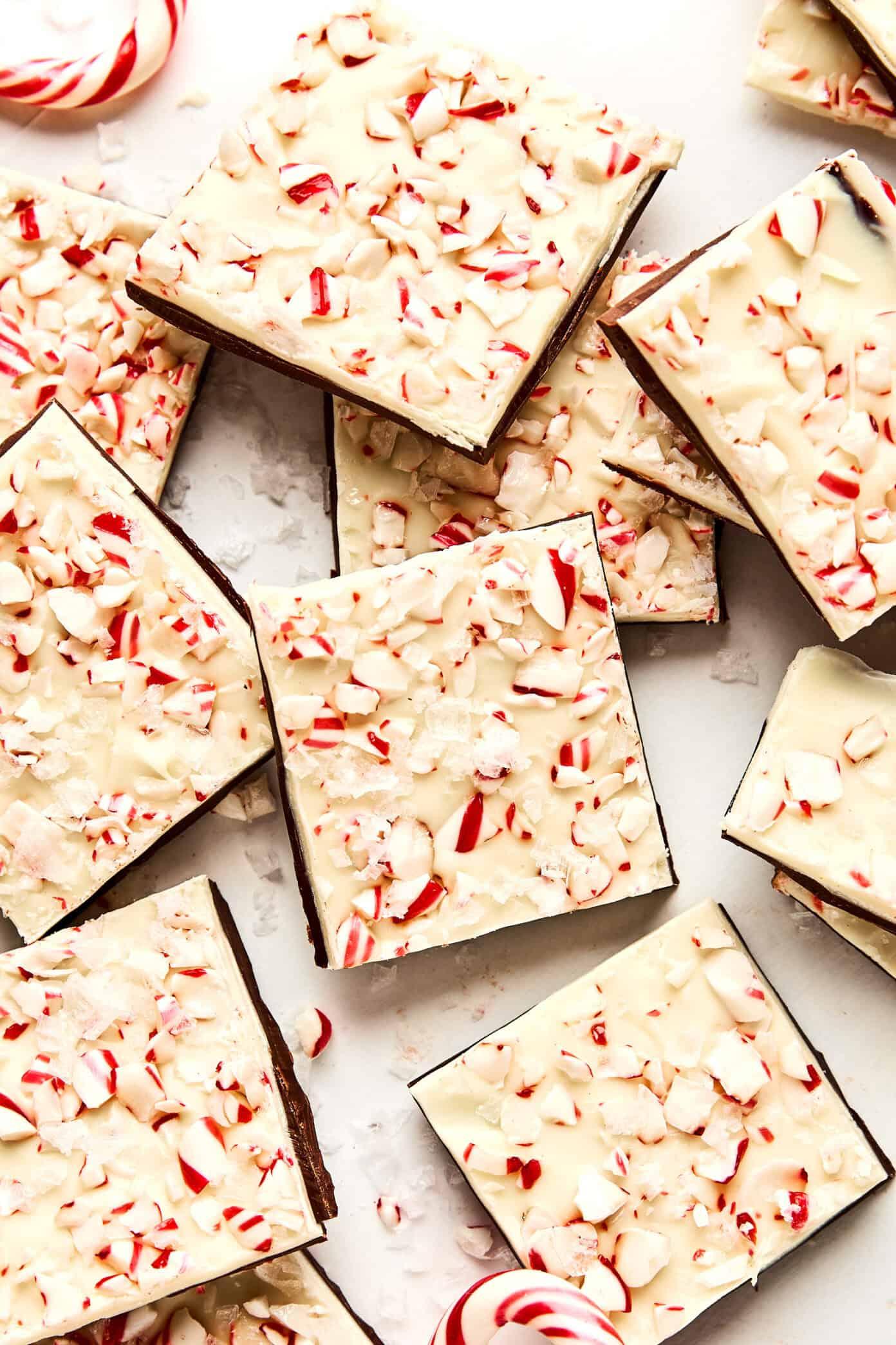 Overhead shot of freshly made peppermint bark cooling on parchment paper