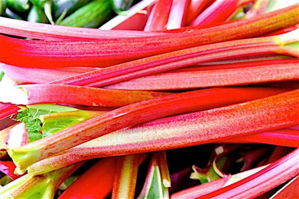 close-up shot of rhubarb stalks next to a bottle of Kahlua