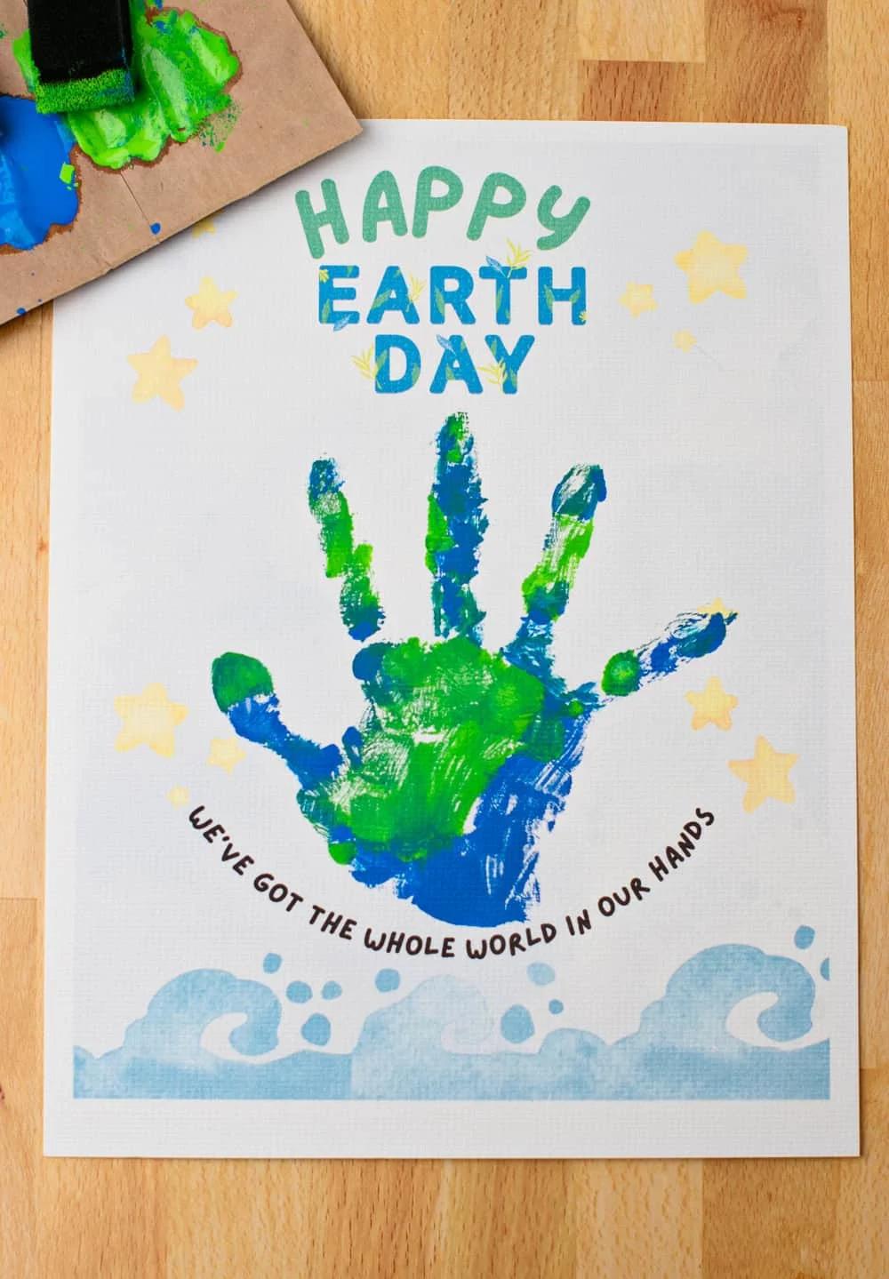 child excited about earth day craft