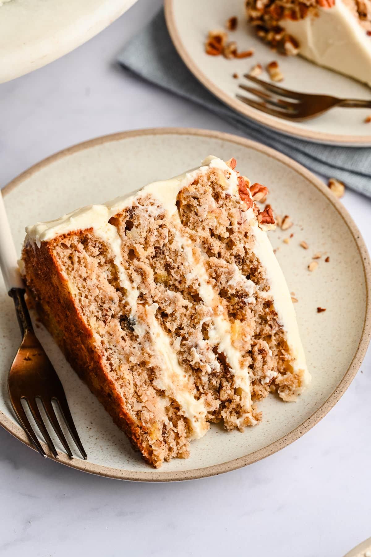 sliced boysenberry burst hummingbird cake on a plate