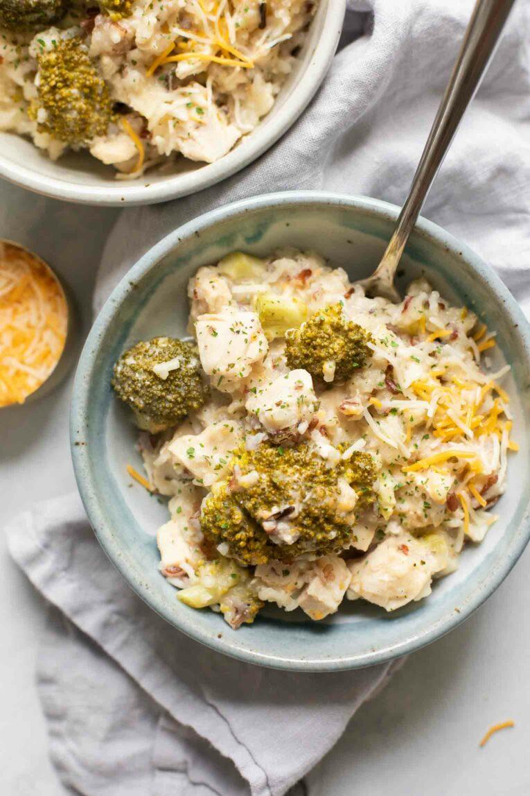 a person enjoying a bowl of healthy crockpot dinner