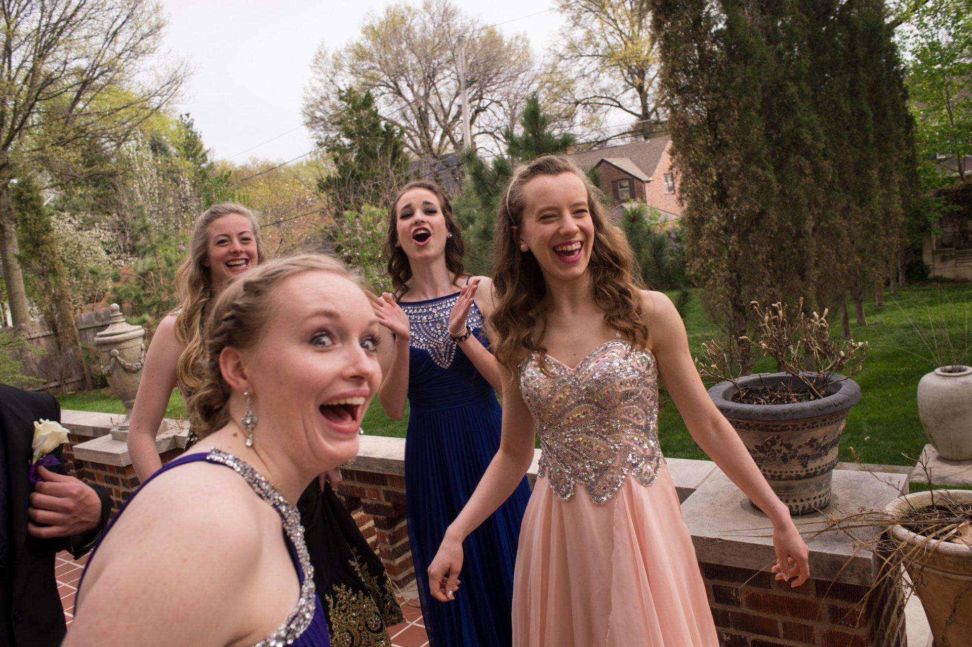 Teen girls laughing and having fun at prom, embracing imperfections