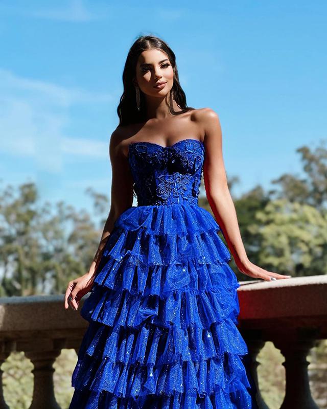 Confident teen girl at prom, wearing a unique and stylish outfit that reflects her personality