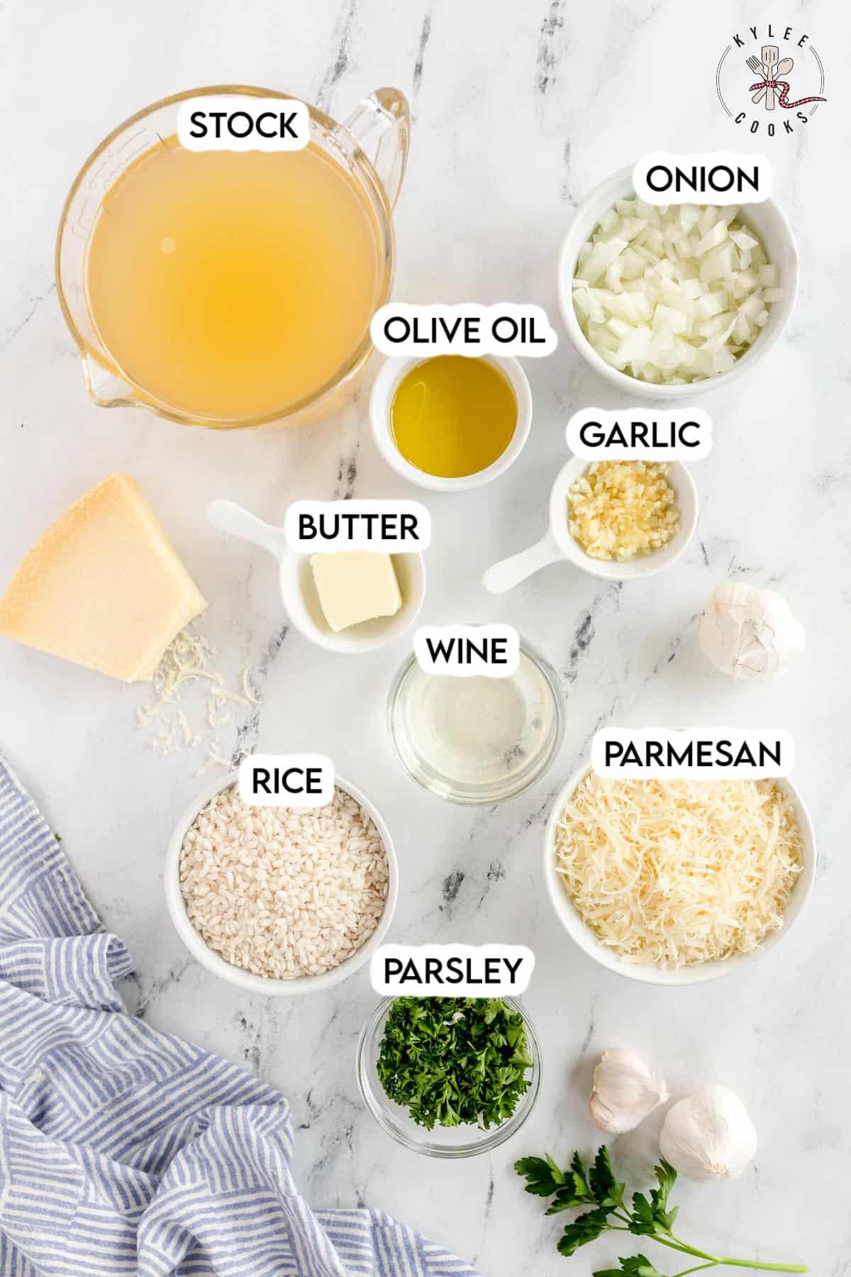 ingredients for rosemary garlic risotto laid out on a wooden table