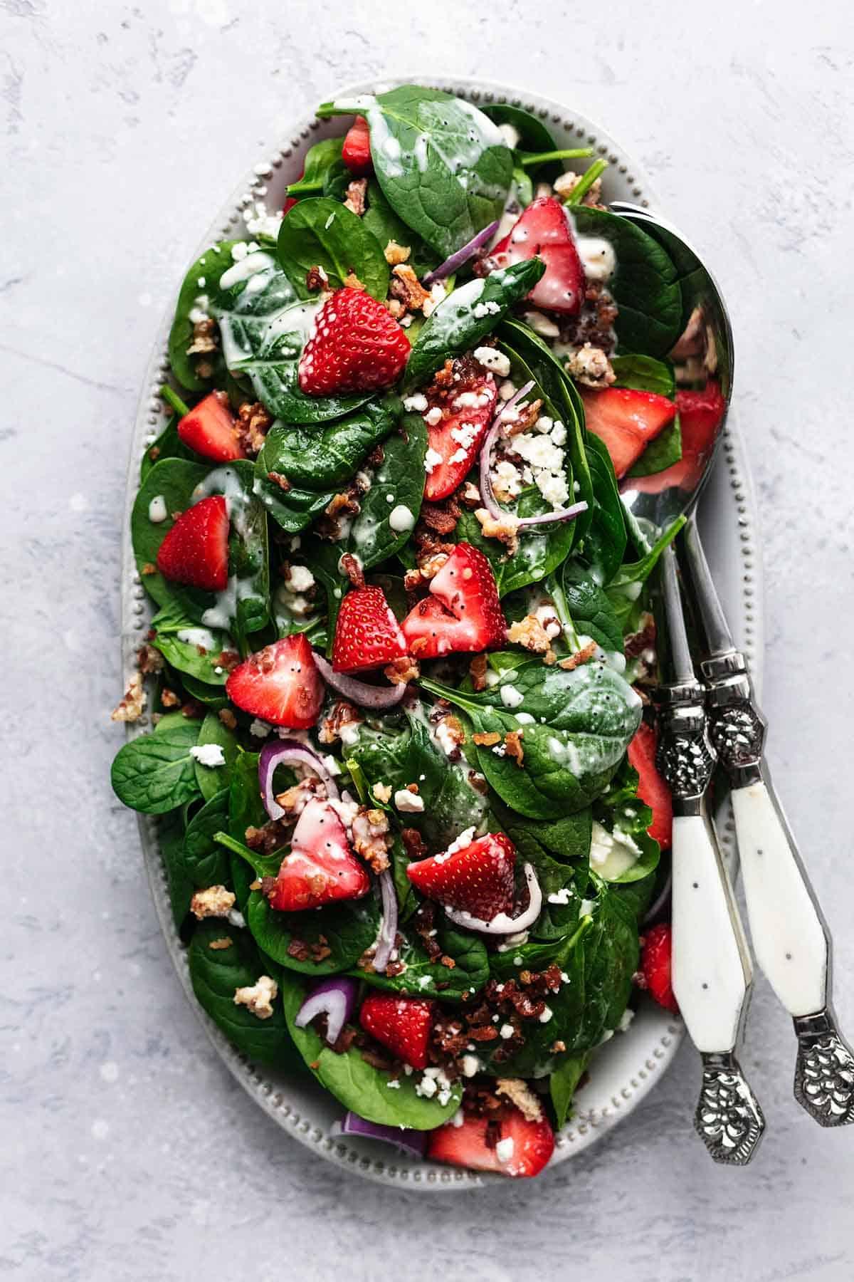 overhead shot of a beautifully arranged strawberry spinach salad
