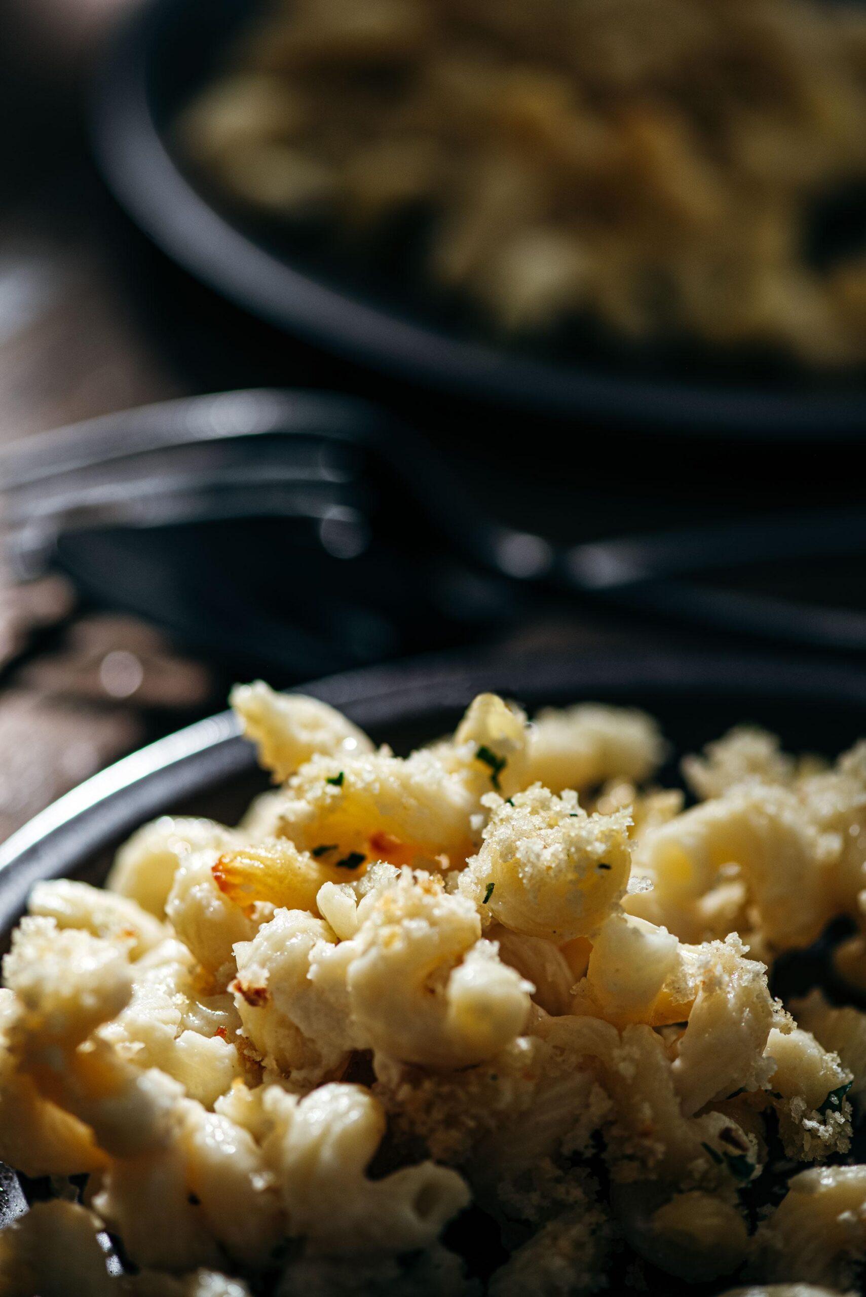 Creamy truffle mac and cheese with a golden crust, close-up, comfort food