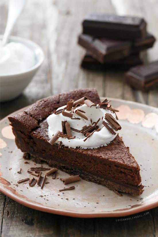 close-up of the smooth, dark chocolate filling of the tart, with a slight sheen and a hint of bourbon aroma