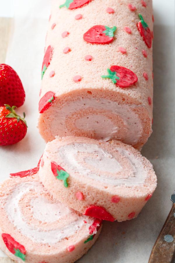 close-up shot of a strawberry shortcake roll slice revealing layers