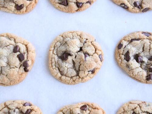 Close-up of a perfectly soft, chewy cookie wedge with melted chocolate chips