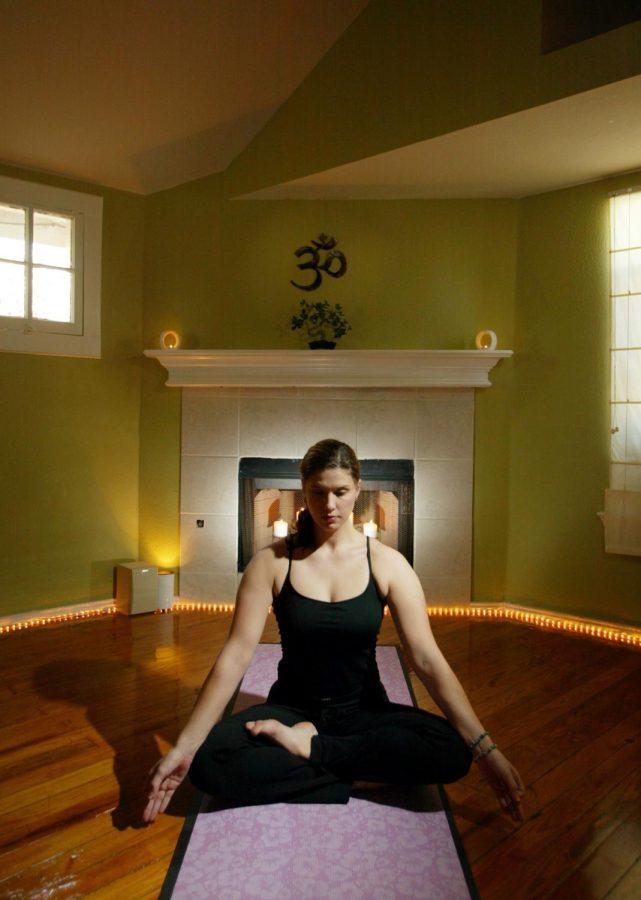 woman meditating in her dorm room
