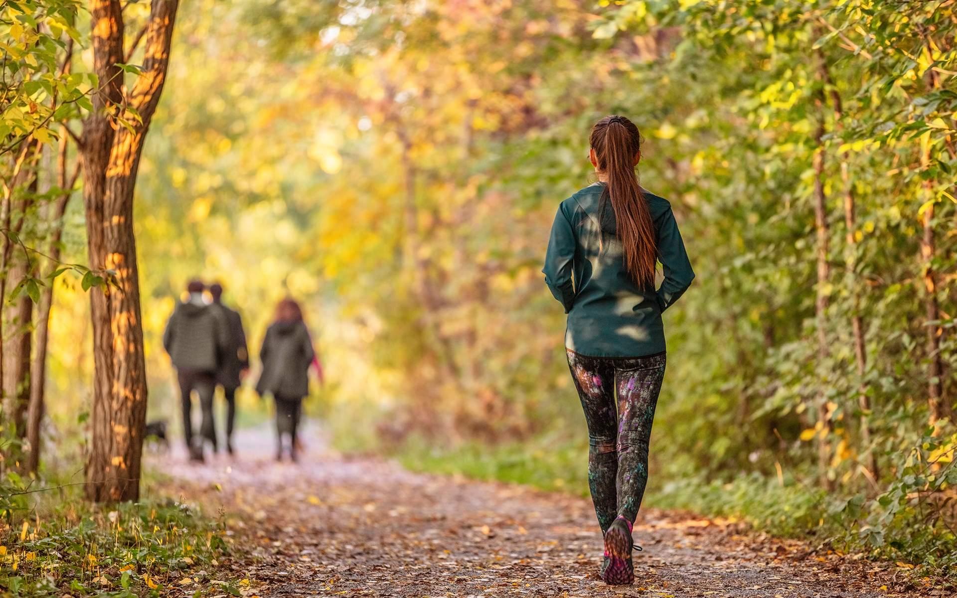 woman practicing mindful walking in a park