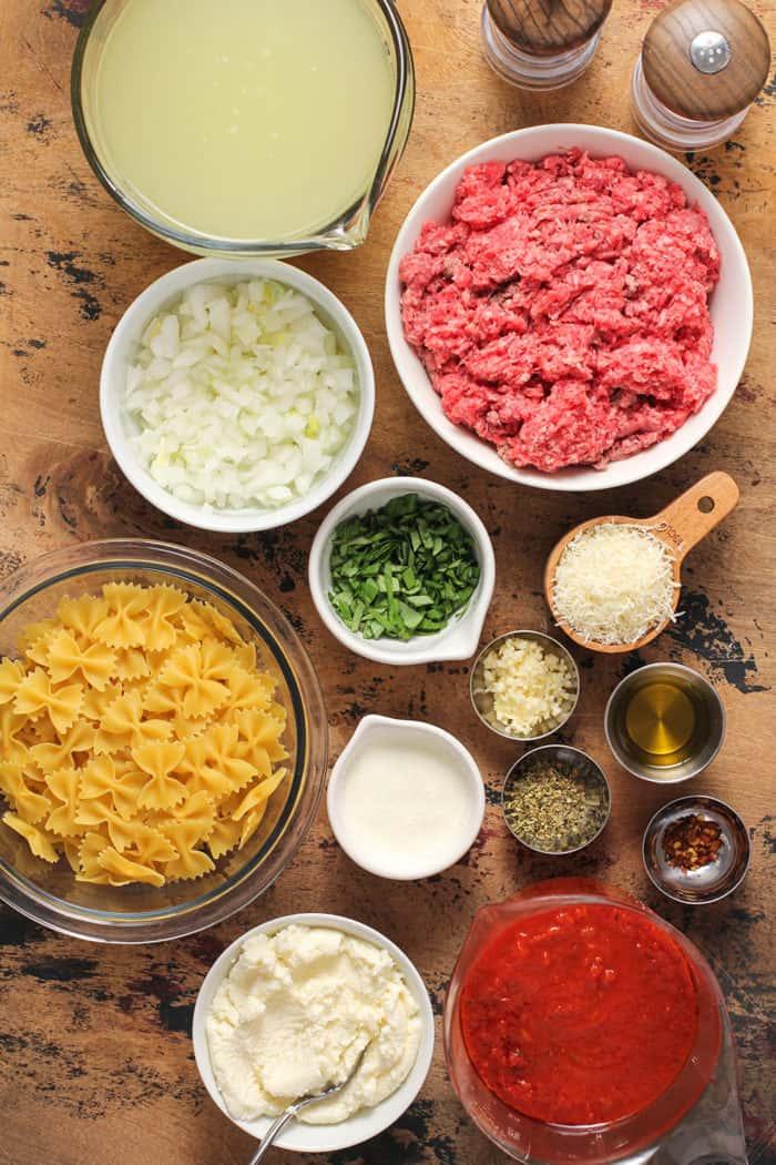 ingredients for lasagna soup arranged on a wooden counter