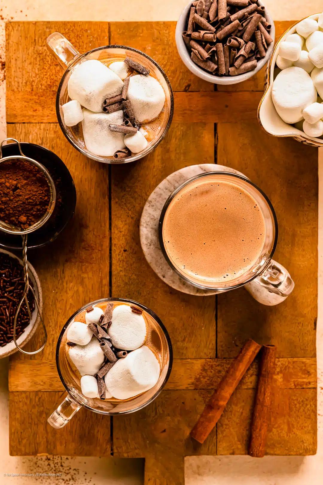 overhead shot of a prepared mocha hot chocolate with chocolate shavings and a spoon