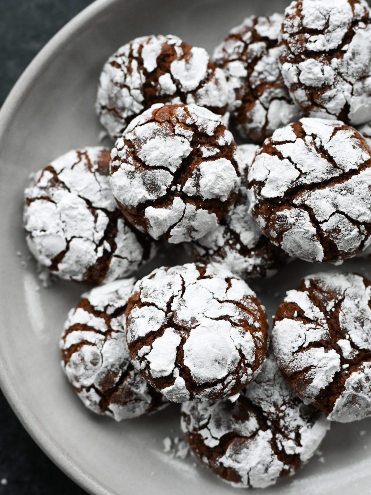 Close-up of a perfectly baked chocolate crinkle cookie with a distinct crinkle pattern