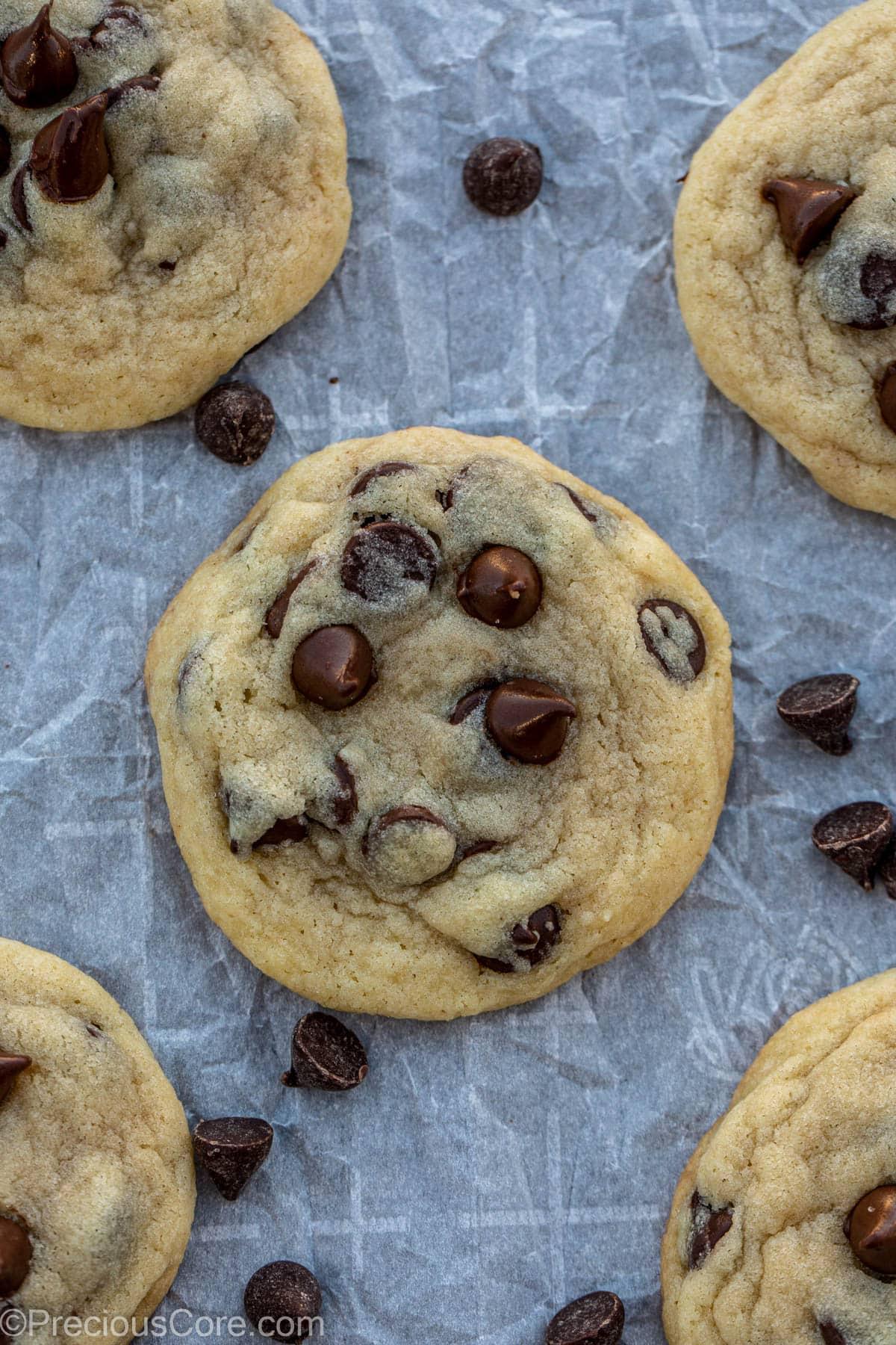 ingredients for chocolate chip cookies arranged on a wooden counter