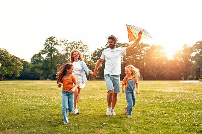 family enjoying time together in a springtime park
