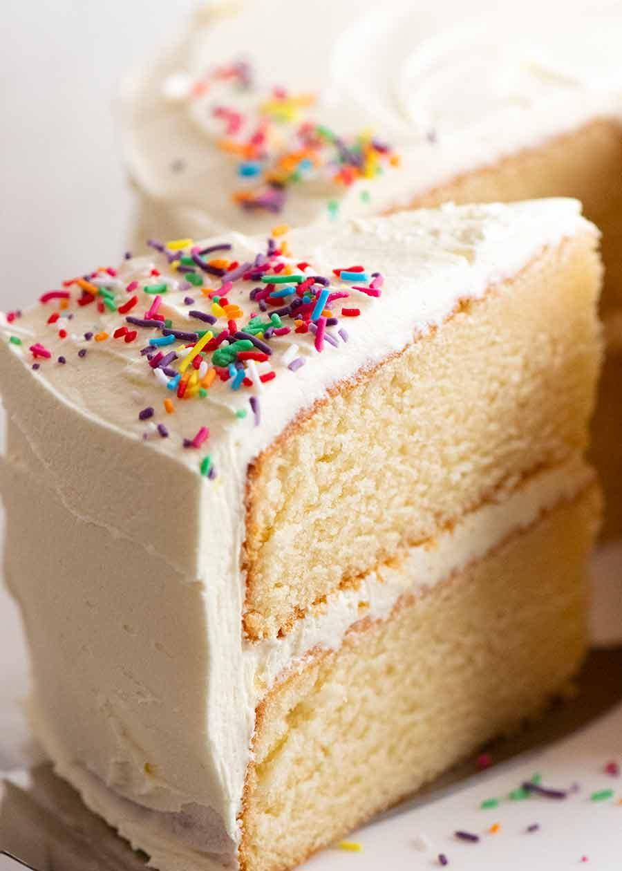 close-up shot of a slice of vanilla birthday cake showing its moist and tender crumb