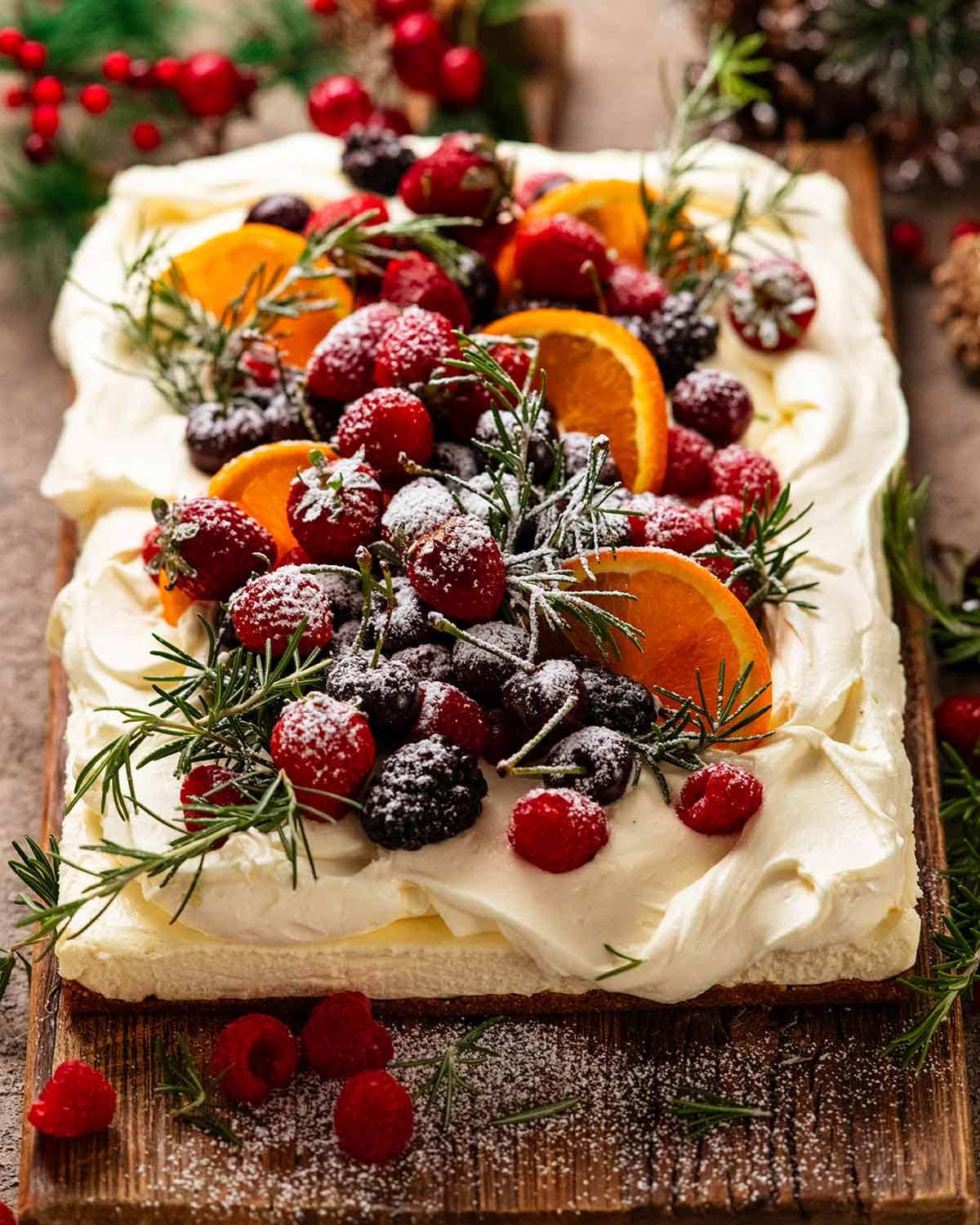 Festive caramel cheesecake with holiday decorations, top view
