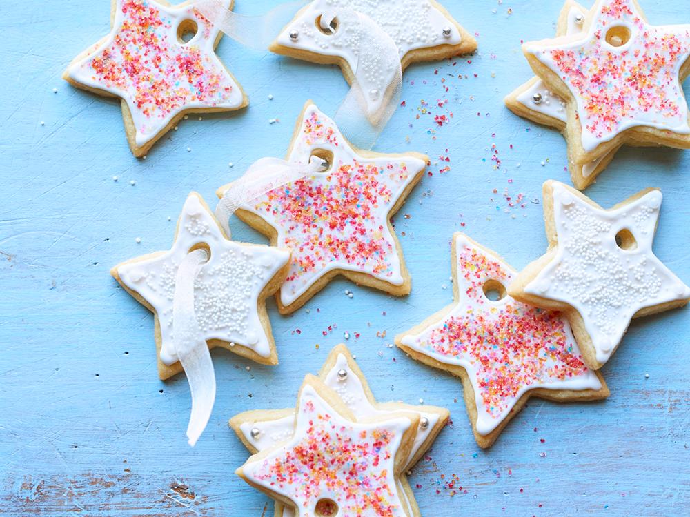 Platter of star-shaped cookies with vibrant glazes and sprinkles
